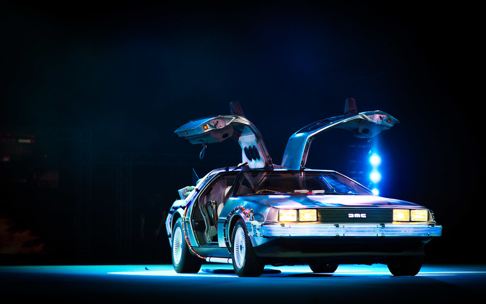 DeLorean at exhibition show with dramatic lighting