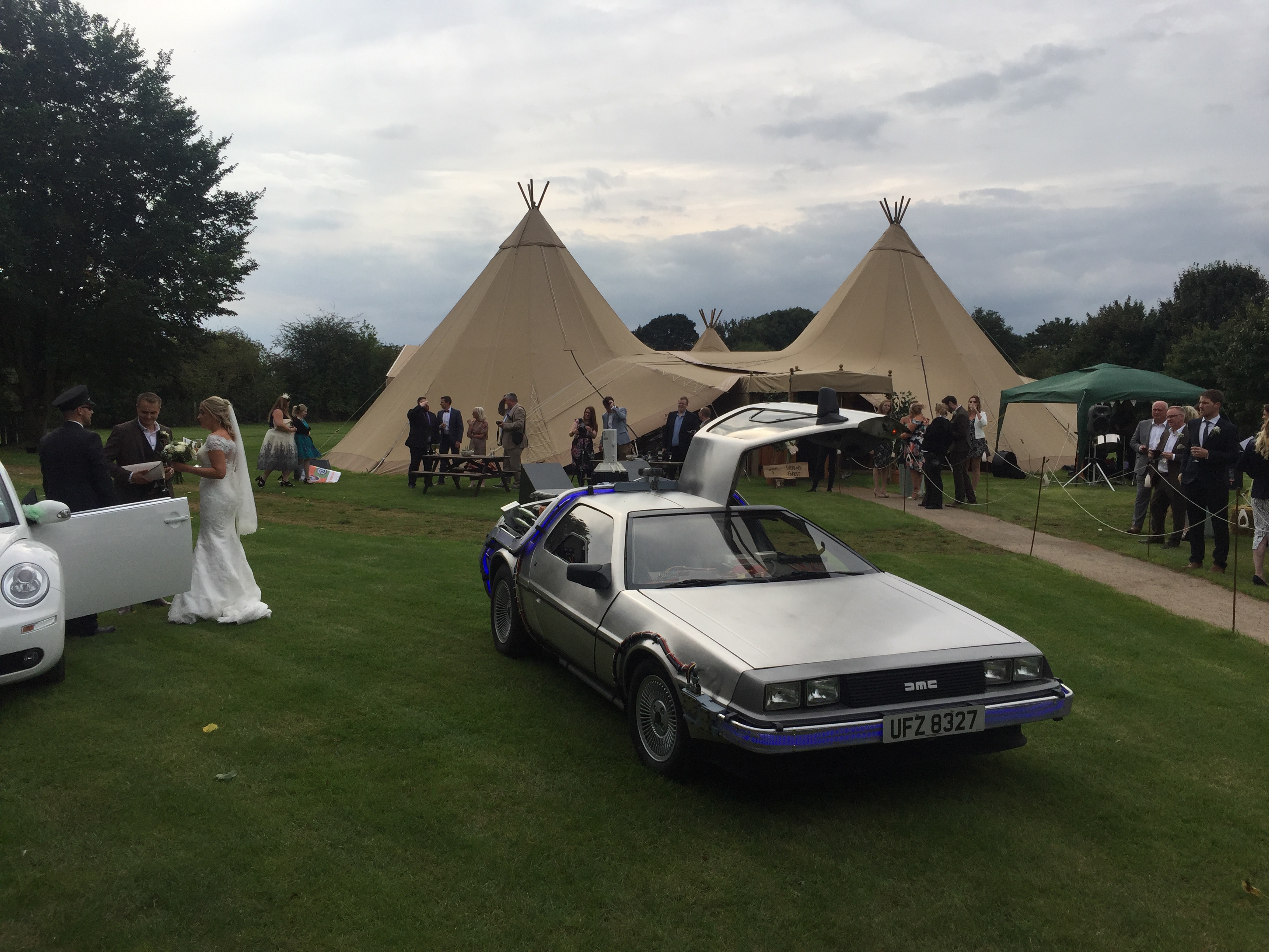 DeLorean at wedding venue with bride